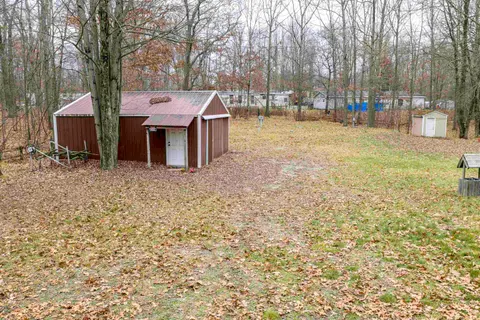 7737 Wilderness Drive, Weidman MI 48893-9739 photo 1