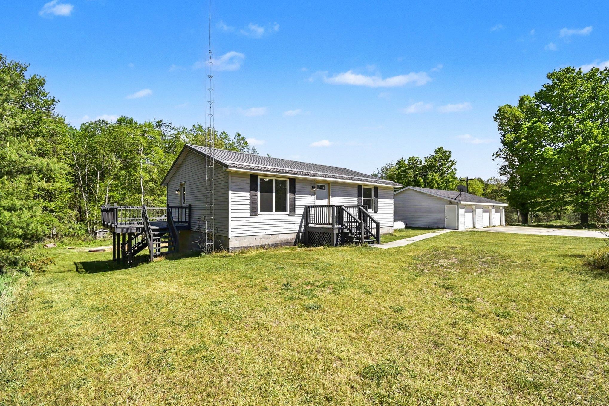 7032 N Woodruff Road, Weidman MI 48893 photo 1